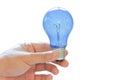 Hand of businessman holding illuminated bulb, idea, innovation and inspiration concept. Royalty Free Stock Photo