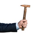 Hand of a businessman holding an old rusty hammer isolated on white Royalty Free Stock Photo