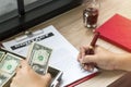 Hand of businessman holding pen to write business document Royalty Free Stock Photo