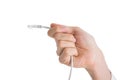 Hand of businessman holding white cable