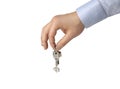 A hand of a businessman keep up a house key isolated