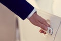 Hand of businessman opening a car door Royalty Free Stock Photo