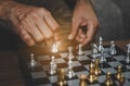 Hand of businessman playing chess .assume making strategy management busninessman plan Royalty Free Stock Photo