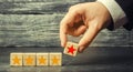 The hand of the businessman separates the fifth star from the other four. The loss of the fifth star, the fall in rating and recog