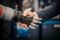 Hand of a businessman shaking hands with a Android robot Royalty Free Stock Photo