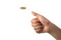 Hand of businessman tossing a golden coin on white back Royalty Free Stock Photo