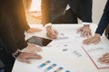 Hand of businessmen write business document charts at office desk. Group of people are business analyzing. Royalty Free Stock Photo