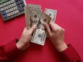 hand of a businesswoman holding american dollars banknotes Royalty Free Stock Photo