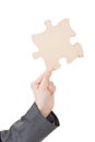Hand of businesswoman with puzzle
