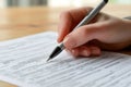 Hand of businesswoman sign on a contract on wooden table.Generative AI Royalty Free Stock Photo