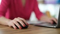 Hand of businesswoman working at computer using mouse closeup Royalty Free Stock Photo