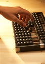 Hand calculating using abacus Royalty Free Stock Photo