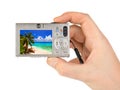 Hand with camera and beach landscape (my photo) Royalty Free Stock Photo