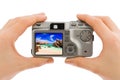 Hand with camera and beach landscape (my photo) Royalty Free Stock Photo