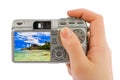 Hand with camera and beach landscape (my photo) Royalty Free Stock Photo