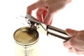 Hand and can with can opener Royalty Free Stock Photo