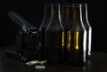 Hand capper with five dark brown bottles and caps Royalty Free Stock Photo