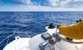 Hand of captain on steering wheel of motor boat in the blue ocean during the fishery day. Success fishing concept. Ocean yacht.