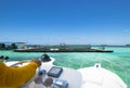 Hand of captain on steering wheel of motor boat in the blue ocean during the fishery day. Success fishing concept. Ocean yacht. Royalty Free Stock Photo