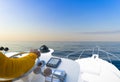 Hand of captain on steering wheel of motor boat in the blue ocean during the fishery day. Success fishing concept. Ocean yacht. Royalty Free Stock Photo