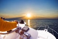 Hand of captain on steering wheel of motor boat in the blue ocean during the fishery day. Success fishing concept. Ocean yacht Royalty Free Stock Photo