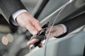 Hand on the car handle. Businessman holding his hand on the casr handle Royalty Free Stock Photo