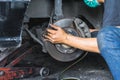 Hand of Car Mechanic Fixing Disc Brakes, Car Maintenance in the Royalty Free Stock Photo