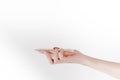 A hand carries smartphone in white background Royalty Free Stock Photo