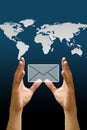 Hand carry the email icon with the world map