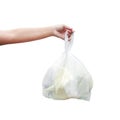 Hand is carrying waste plastic garbage bags isolated white background, Hand holding plastic garbage bags for dump waste Royalty Free Stock Photo