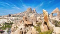 Hand carved rooms in limestone rocks and castle of Uchisar in Cappadocia, Turkey