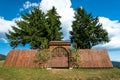 Hand carved wood entrance to a small catholic chapel in the mountains.