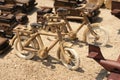 A handcarved wooden toy bicycle