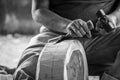 Hand of carver carving wood in blackand white color tone Royalty Free Stock Photo