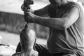 Hand of carver carving wood in blackand white color tone Royalty Free Stock Photo