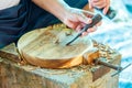 Hand of carver carving wood