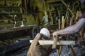 Hand carving a wooden bowl with a foot powered wood lathe Royalty Free Stock Photo