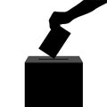 Hand casts ballot in the ballot box in elections silhouette Royalty Free Stock Photo