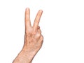Hand of caucasian middle age man over isolated white background counting number 2 showing two fingers, gesturing victory and Royalty Free Stock Photo