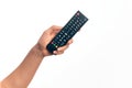 Hand of caucasian young man changing tv channel holding remote control over isolated white background Royalty Free Stock Photo