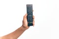 Hand of caucasian young man changing tv channel holding remote control over isolated white background Royalty Free Stock Photo