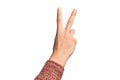 Hand of caucasian young man showing fingers over isolated white background counting number 2 showing two fingers, gesturing Royalty Free Stock Photo