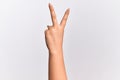 Hand of caucasian young woman counting number 2 showing two fingers, gesturing victory and winner symbol Royalty Free Stock Photo