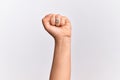 Hand of caucasian young woman doing protest and revolution gesture, fist expressing force and power