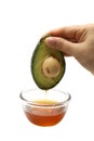 Hand caught avocado with honey