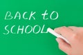 Hand with chalk writing Back to school Royalty Free Stock Photo