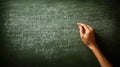 Hand Writing Complex Mathematical Formulas on a Green Chalkboard Royalty Free Stock Photo