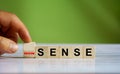 Hand changes the word `Sense` to ` Non sense