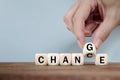 Hand Changing word from CHANGE  to CHANGE On Wooden Cube Royalty Free Stock Photo