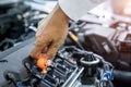 Hand checking engine oil car, Auto mechanic working Royalty Free Stock Photo